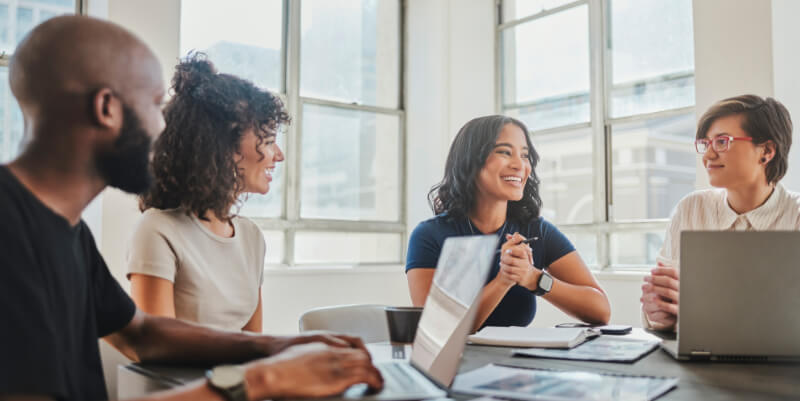 Creative and advertising business meeting with collaboration, teamwork and communication from team. Support, strategy and social media marketing people working with advertising data, graph and chart