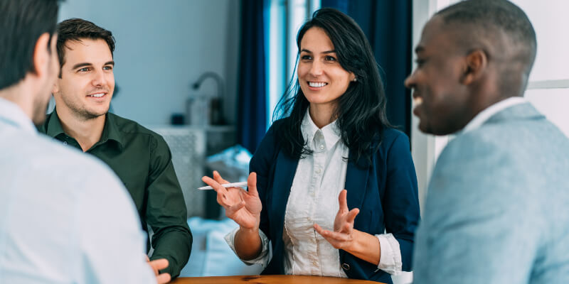Group of business persons in business meeting. Multi-ethnic group of entrepreneurs on meeting in board room. Corporate business team on meeting in modern office.
