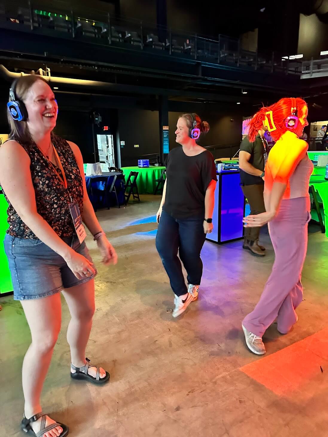 Three women dancing while wearing headphones- Silent Disco!