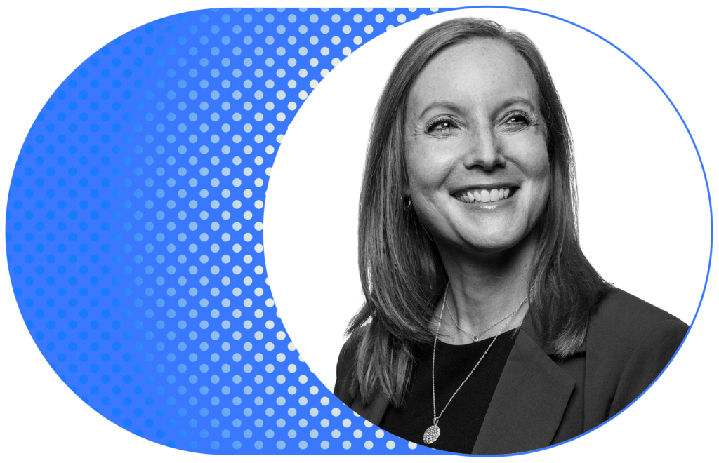 Black-and-white headshot of a smiling woman against a blue patterned graphic background.